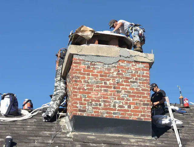 Murrieta Chimney Sweep installing a custom chimney crown in Murrieta, CA
