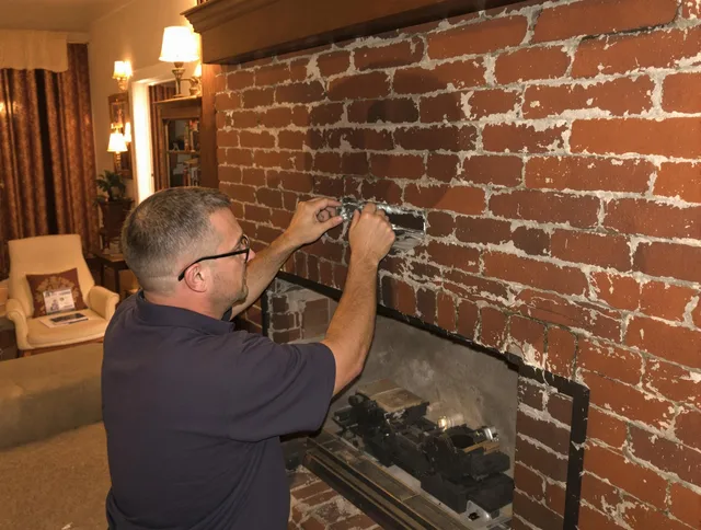 Murrieta Chimney Sweep expert fixing a fireplace in Murrieta, CA